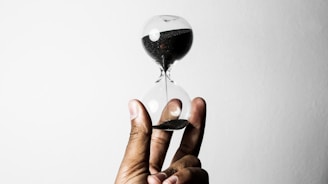 person holding hourglass