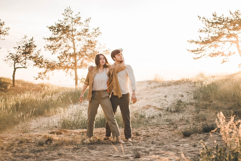 photography of woman and man standing near outdoor during daytime