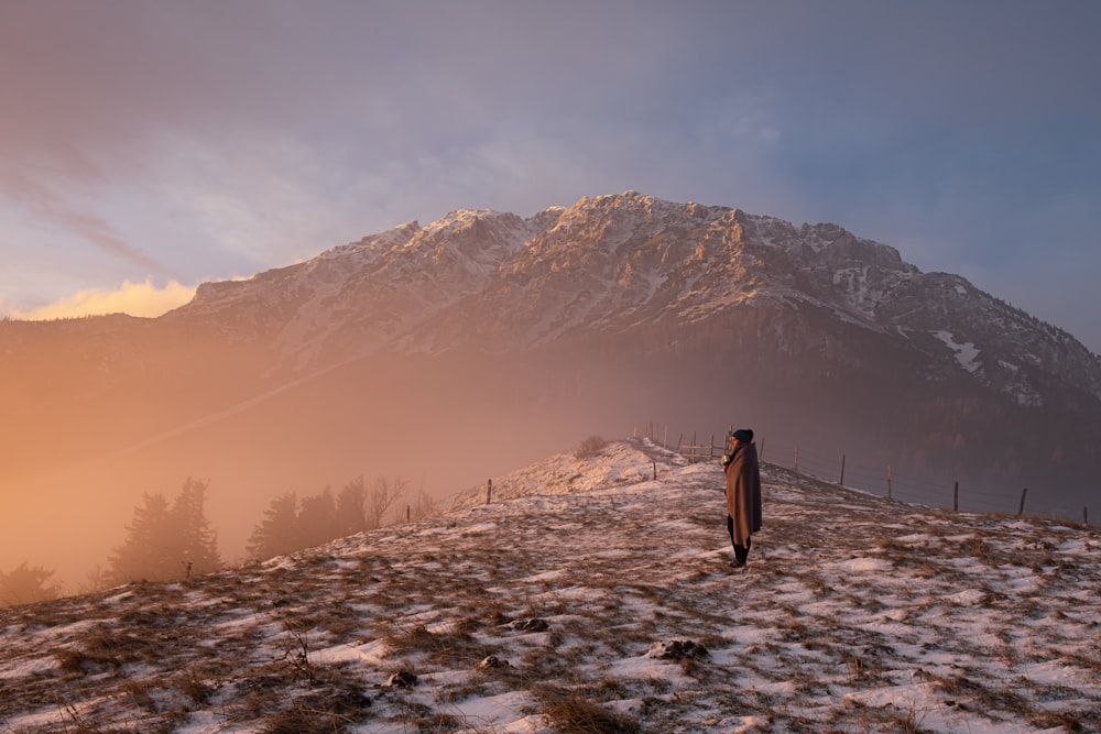 woman standing near mountain
