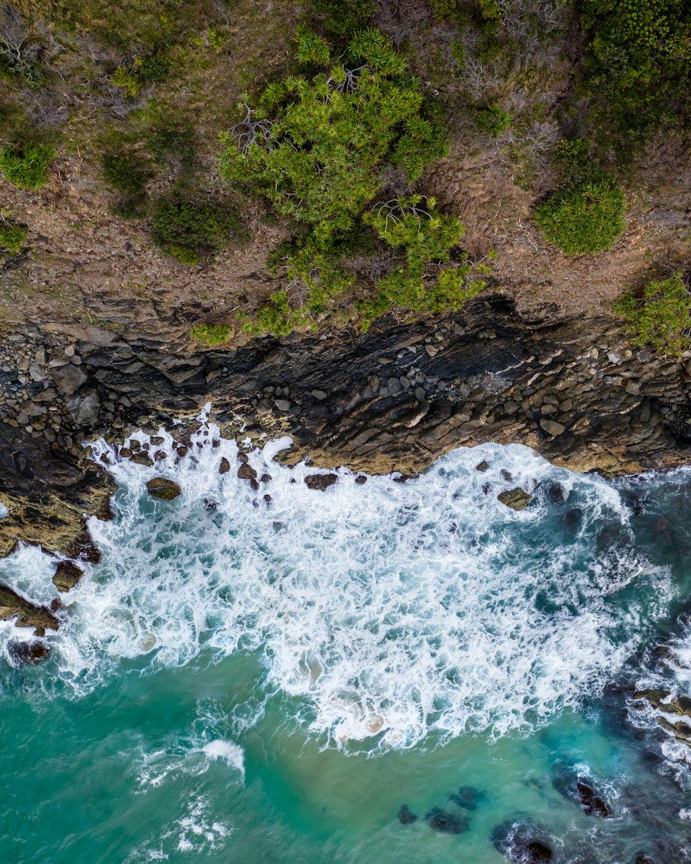 sea waves crashing on stone