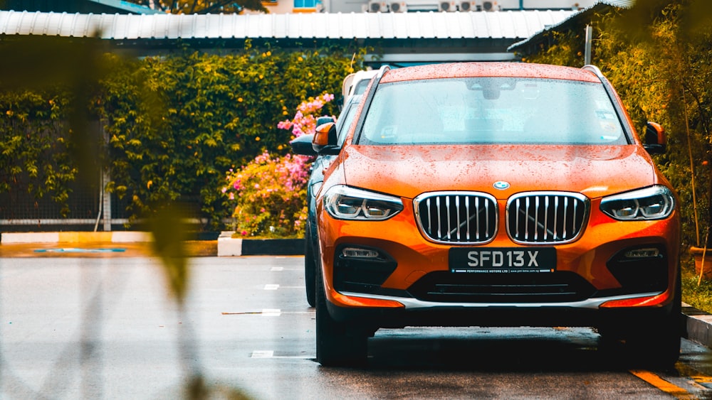 orange BMW vehicle