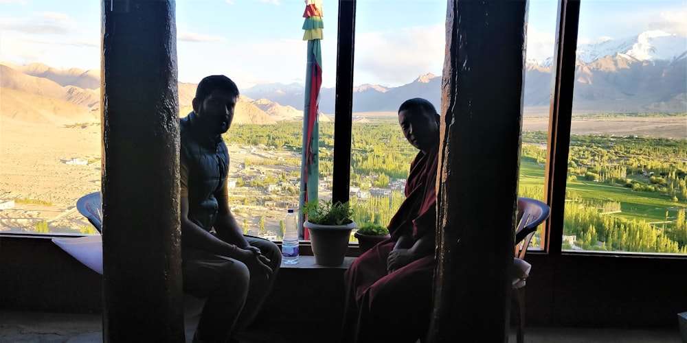 two person sitting on chair