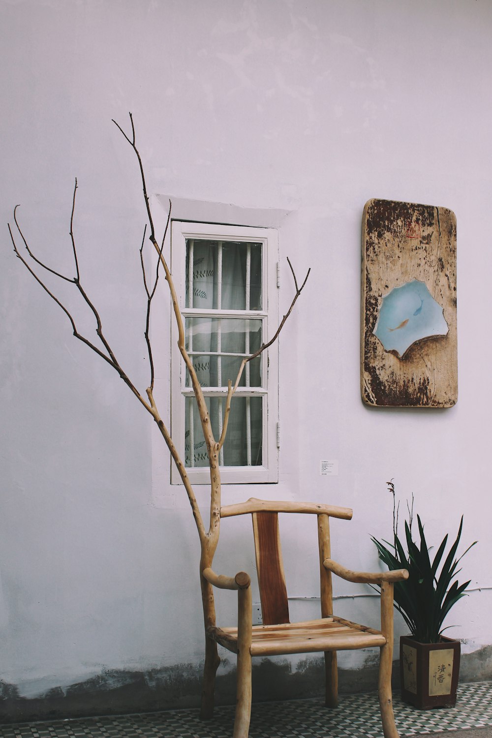 brown wooden armchair outside window