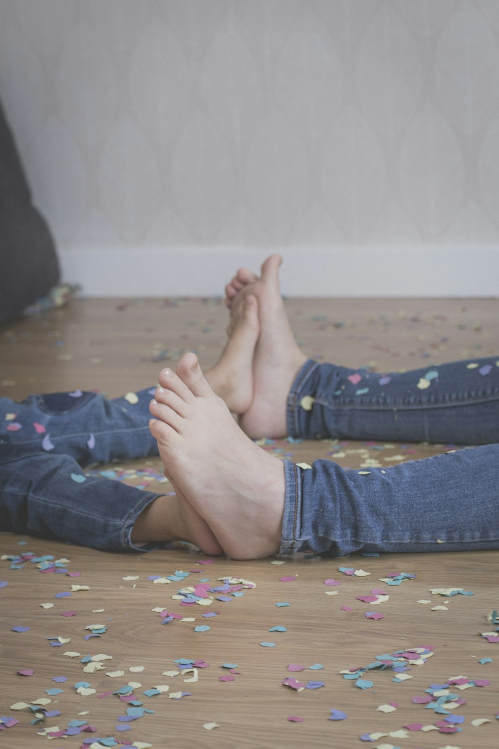 a person laying on the floor with their feet up