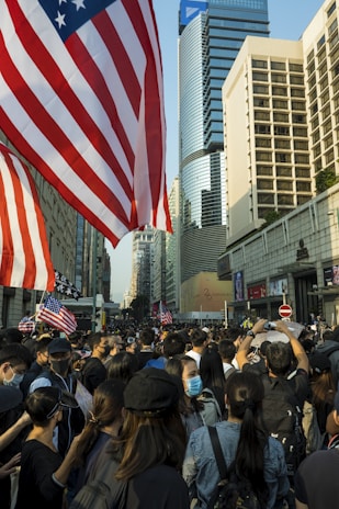 A vibrant crowd gathered outside Independence Hall in Philadelphia, waving CDC-USA flags with enthusiasm.