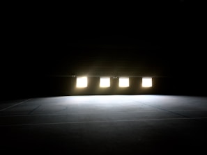 Evening session with players competing under warm indoor lighting at the club