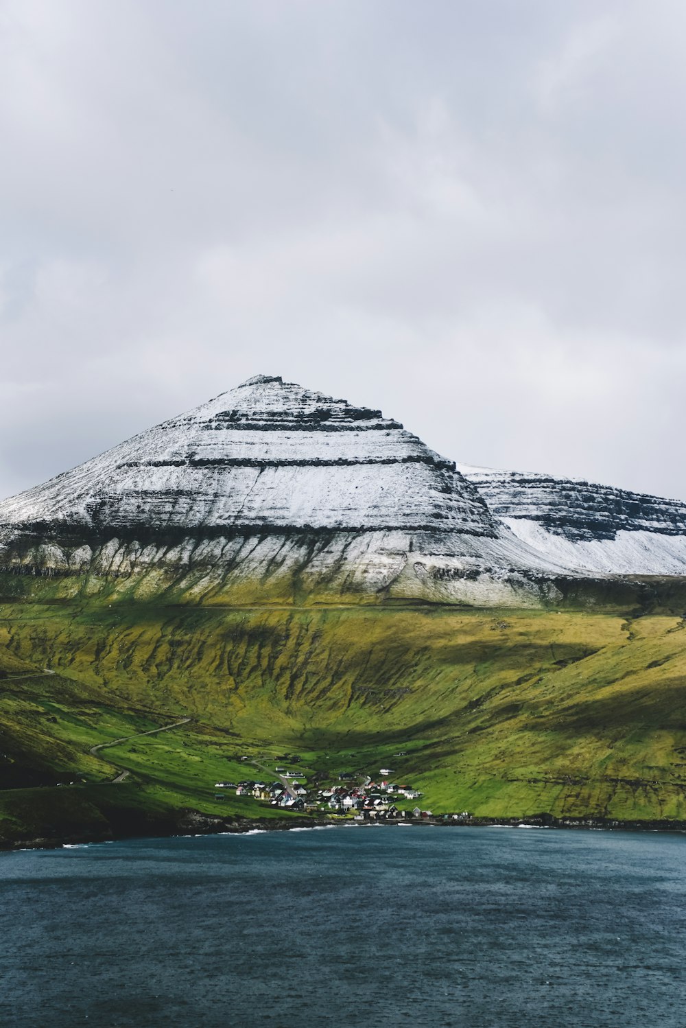 mountain near body of water during daytime