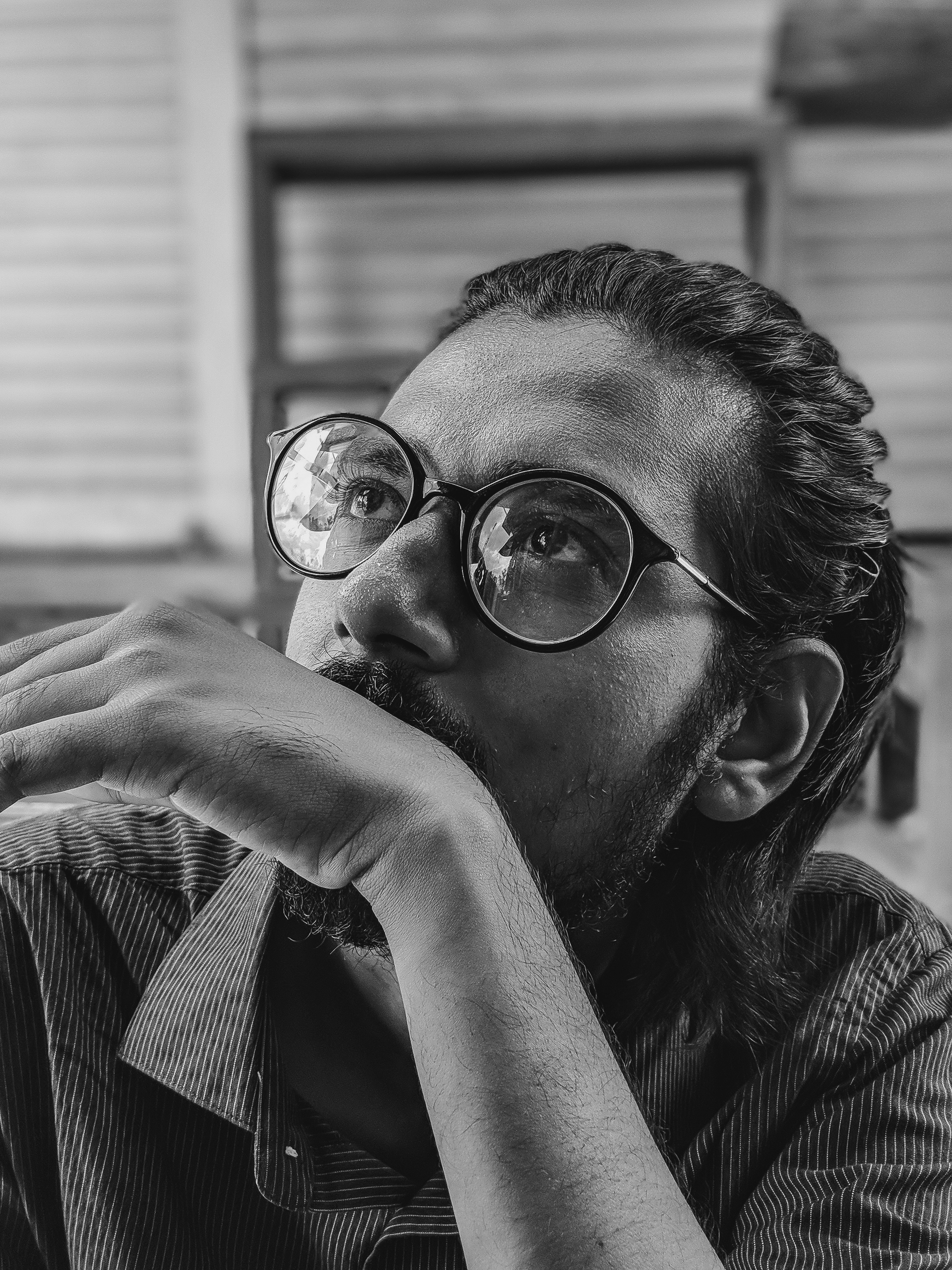 grayscale photo of man wearing eyeglasses