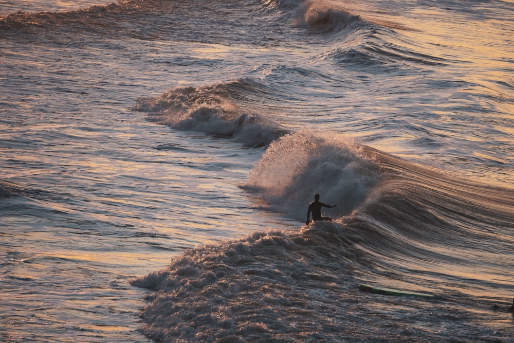 man surfing photograph