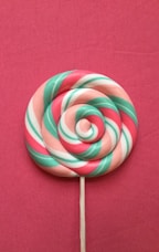 green-red-beige-and-white lollipop