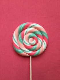 green-red-beige-and-white lollipop
