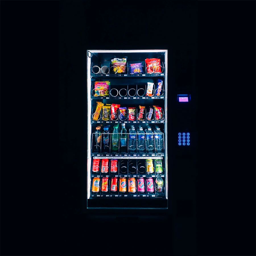 Modern vending machine stocked with snacks and drinks