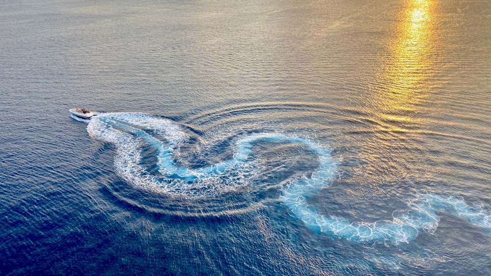 motorboat on calm sea water during daytime