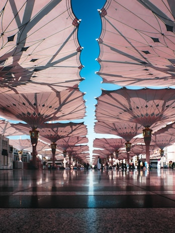 people walking between umbrellas during daytime