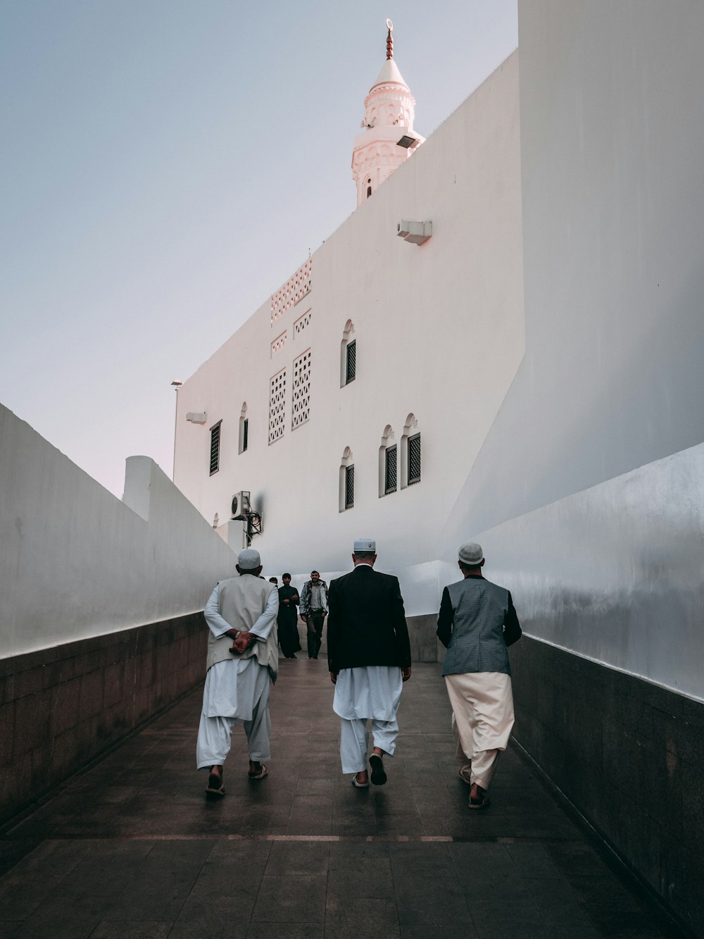 men walking outside building