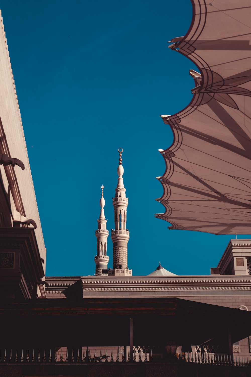 low-angle photography of a building under a calm blue sky during daytime