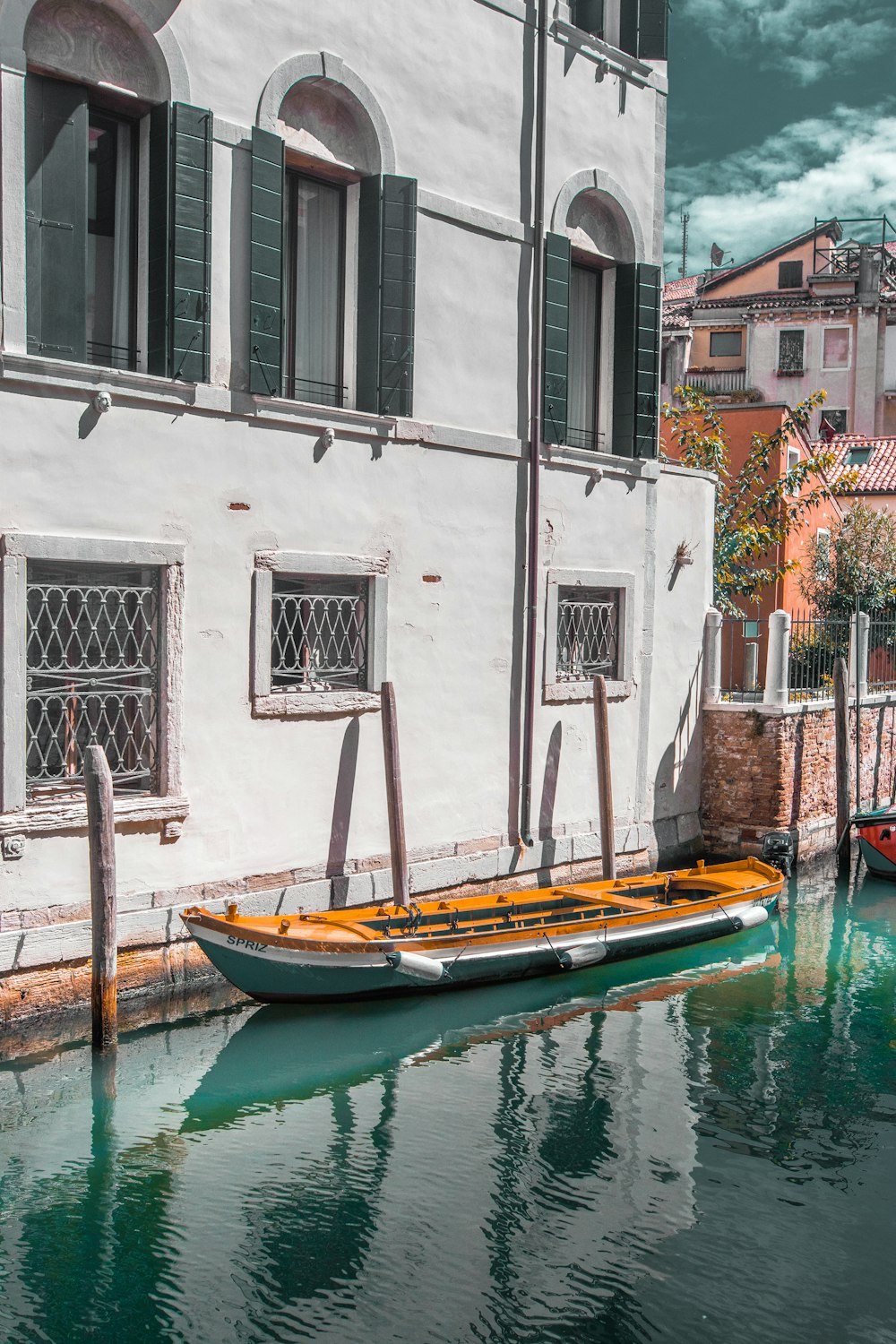 white and yellow canoe boat