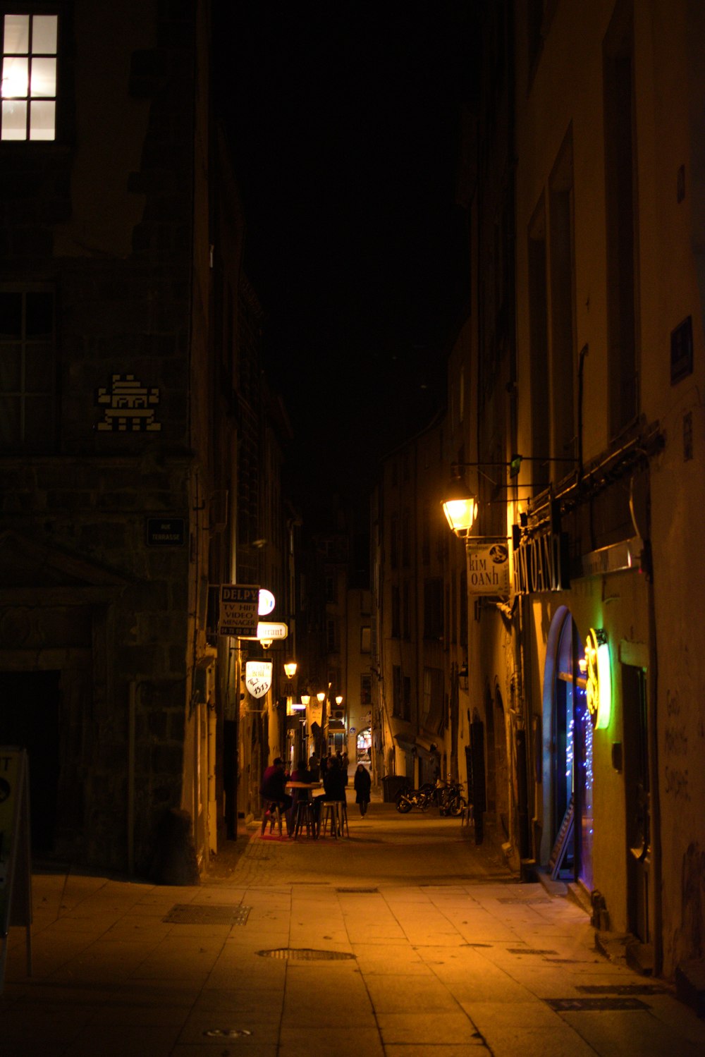 low-light photo of pathway in between of buildings