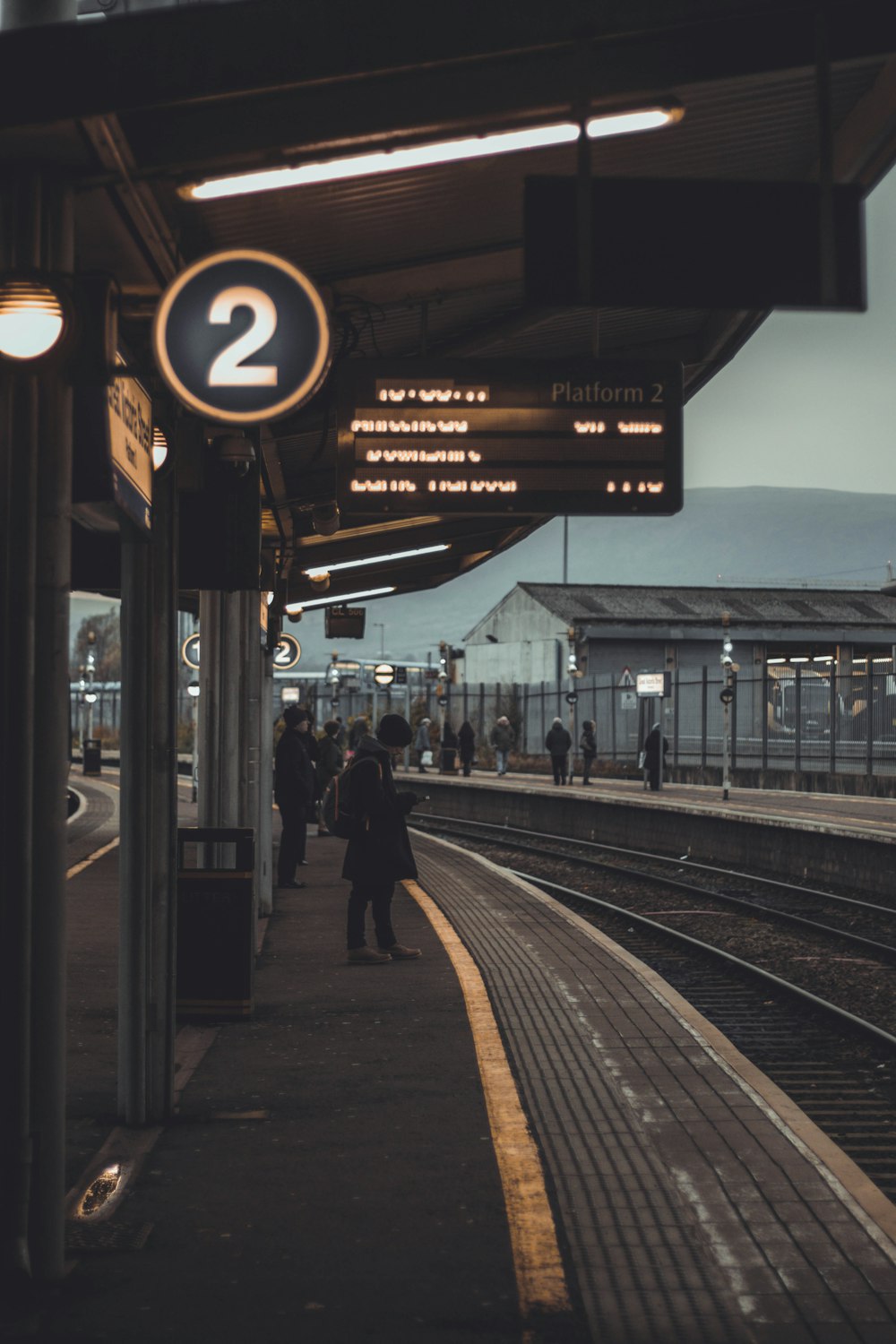 person standing on train station