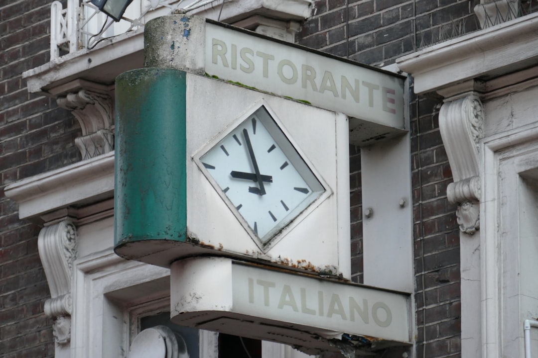 Ristorante Italiano clock signage on wall