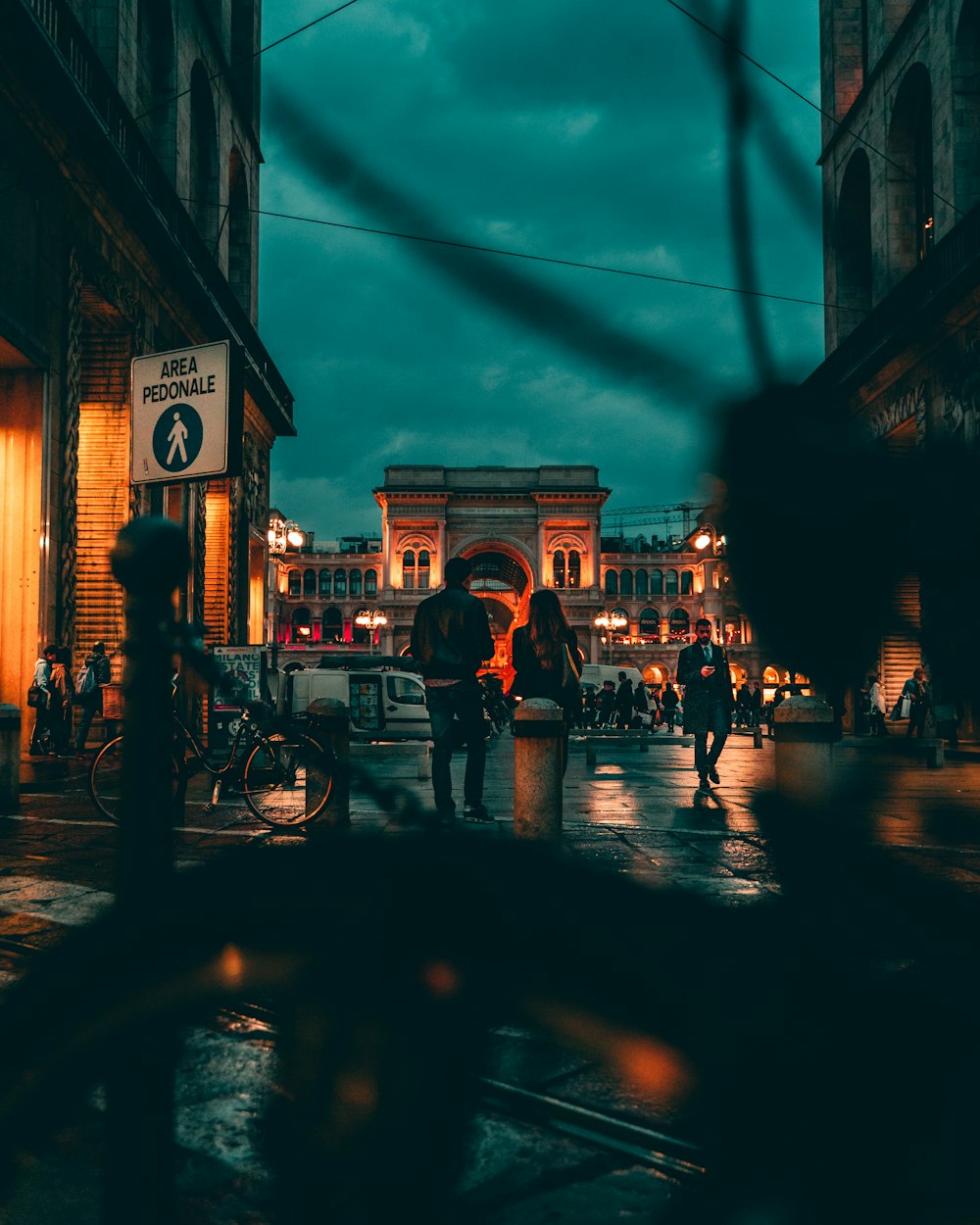 silhouette of people walking on street