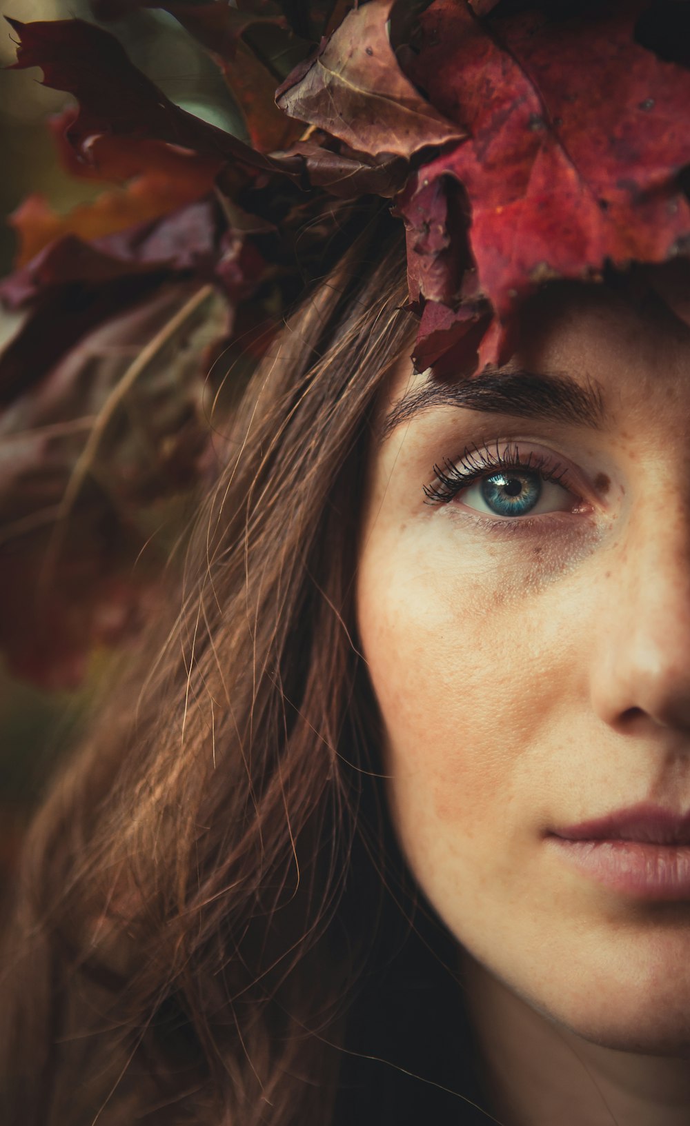 a woman with a wreath of leaves on her head