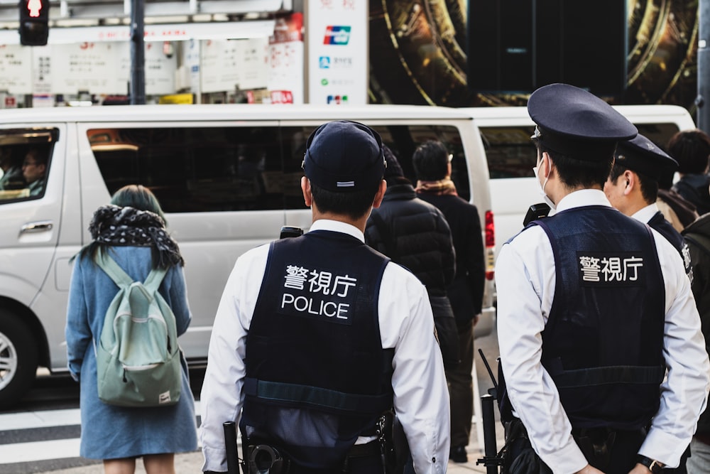 people standing beside street