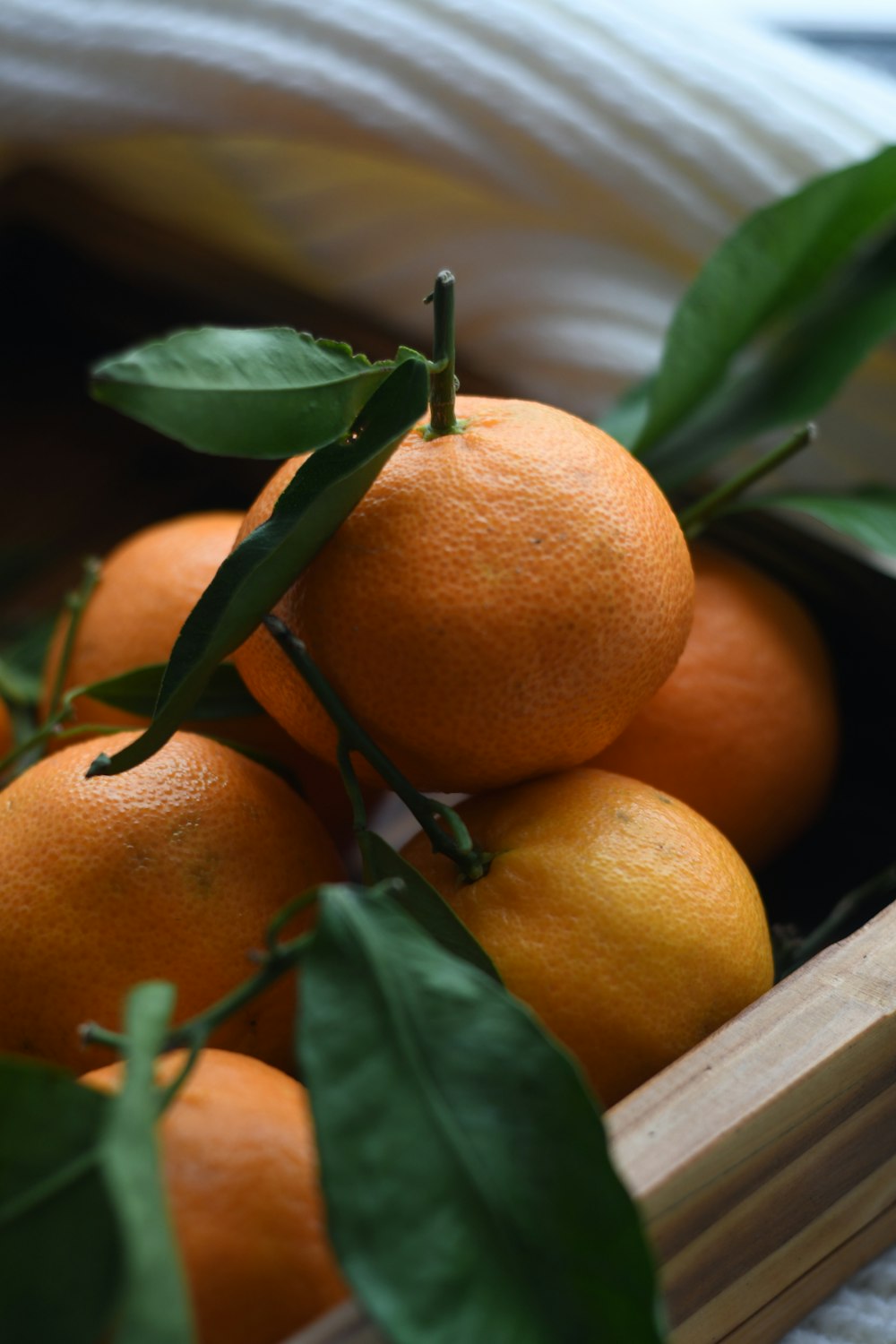 orange fruit on brown wooden tray