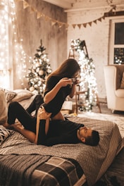 A cozy Christmas photo session setup with festive decorations and warm lighting.