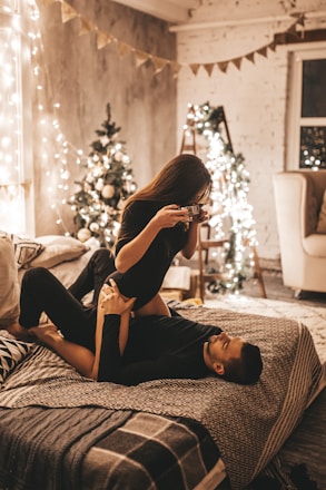 A cozy Christmas photo session setup with festive decorations and warm lighting.