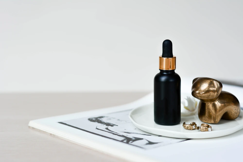 Black dropper bottle with gold band