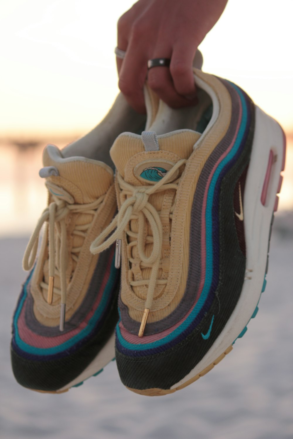 black-and-beige Nike Air Max 97