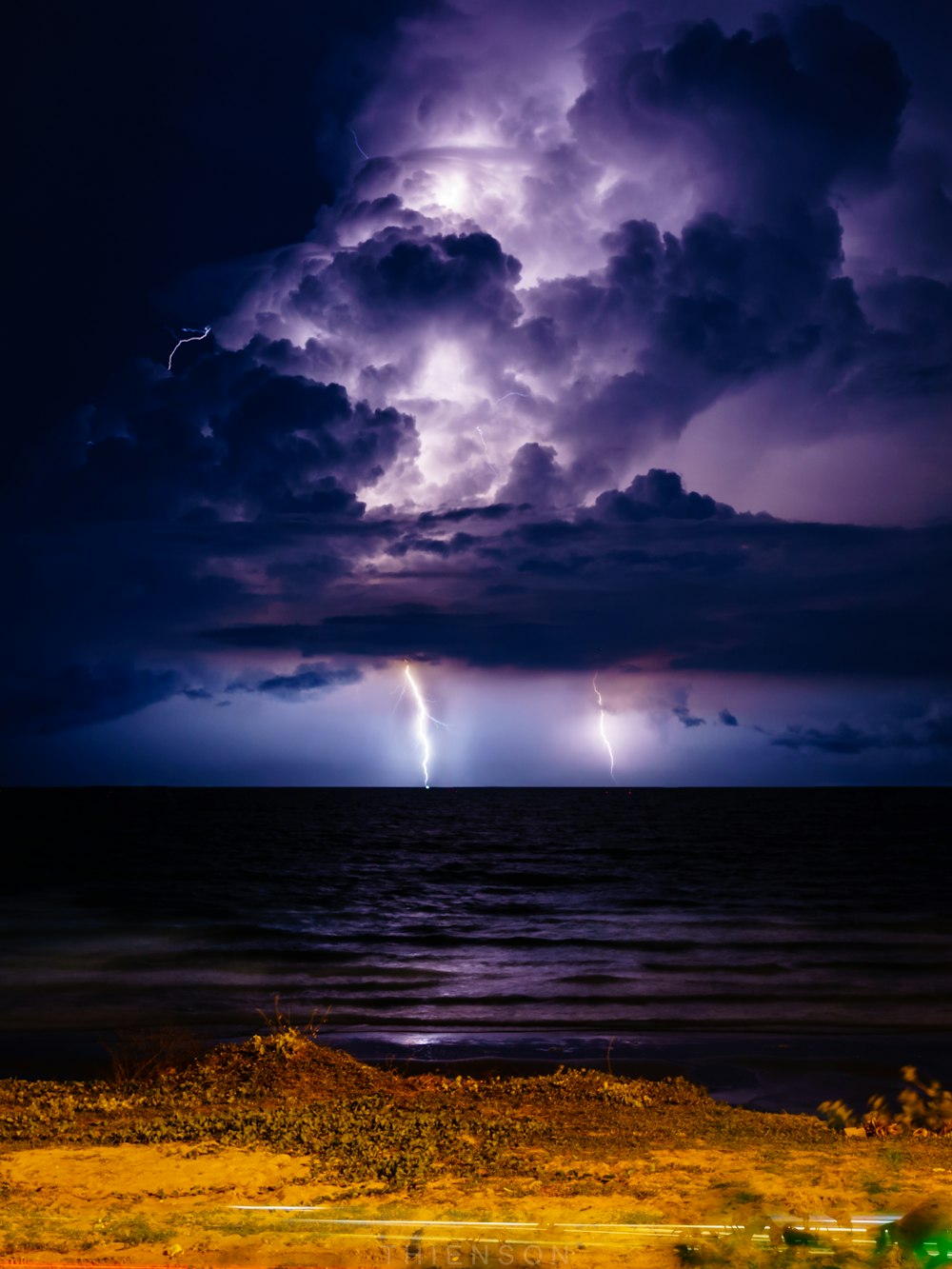 purple sky with clouds and lightning