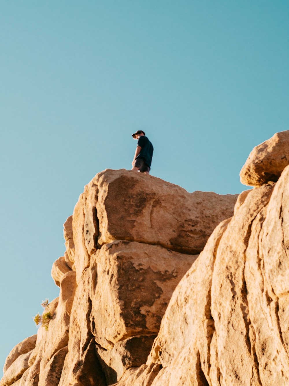 man standing on rock