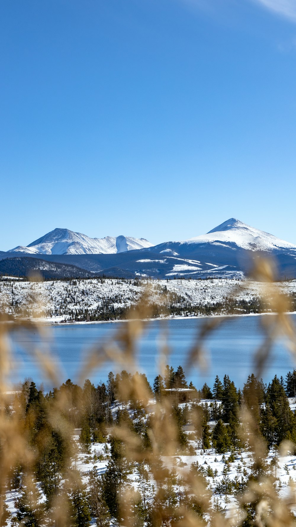 mountain near calm body of water