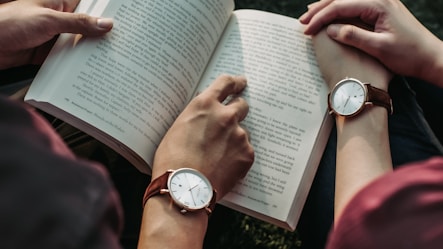 two people reading book