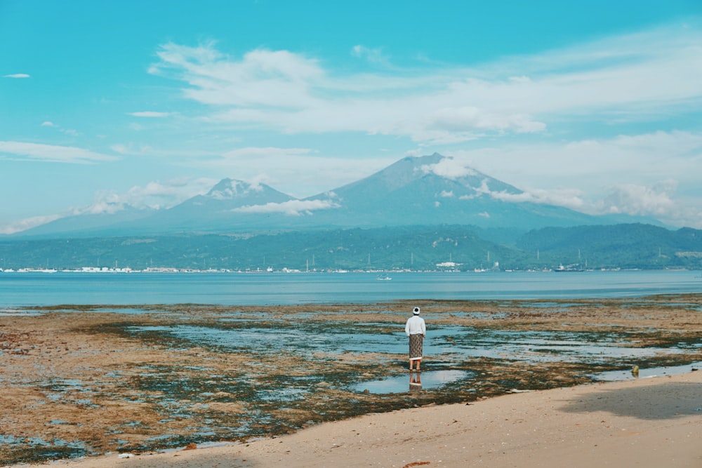 woman standing in front of the mountain