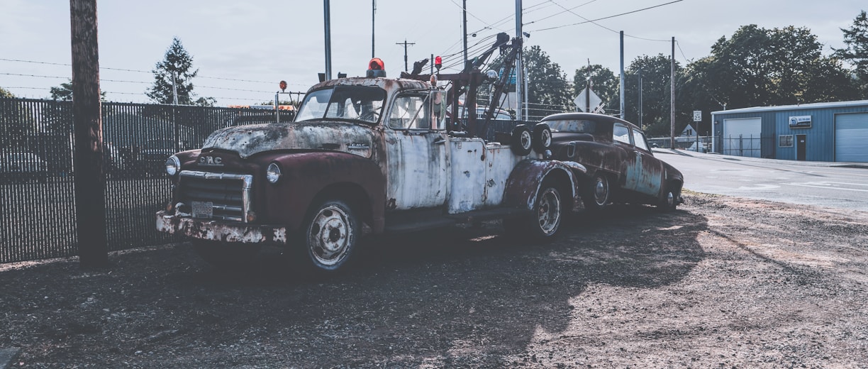 view photography of vehicle near electric post