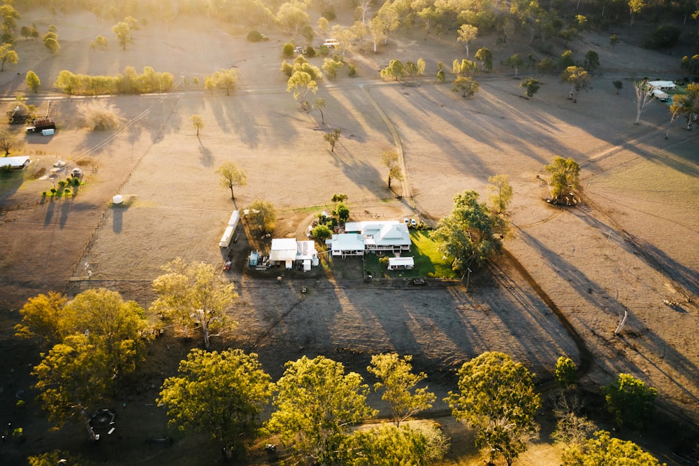 aerial photography of white house surrounded by trees