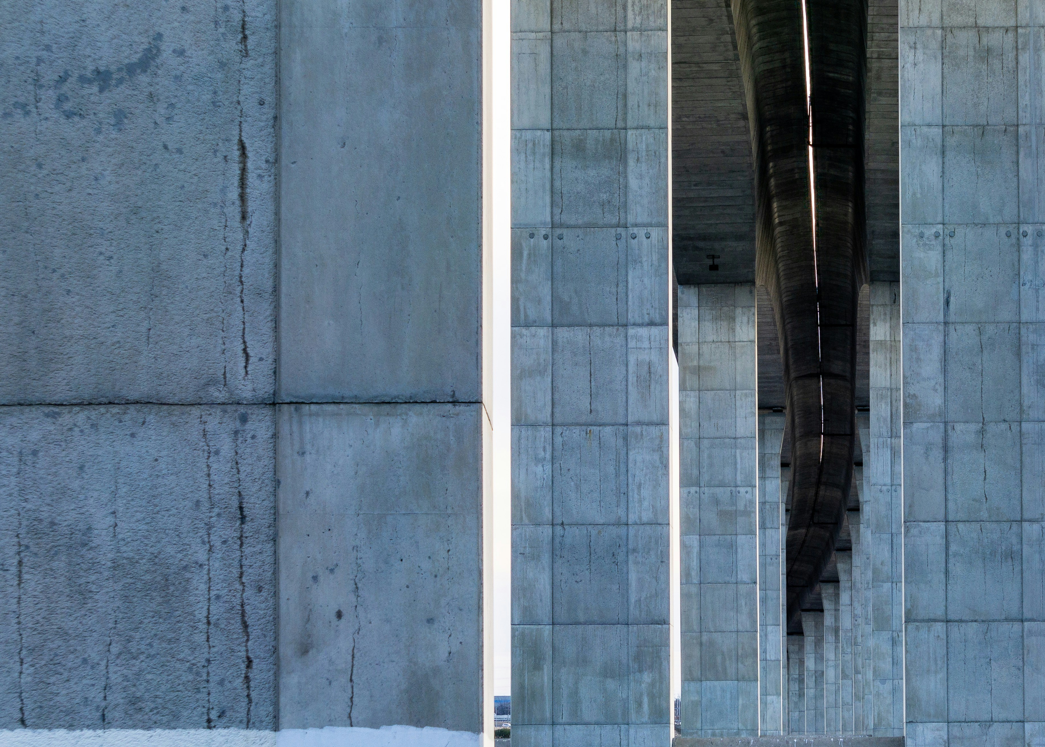 a man riding a skateboard next to a tall building