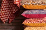 assorted-color stack of pillows