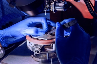 man holding silver component