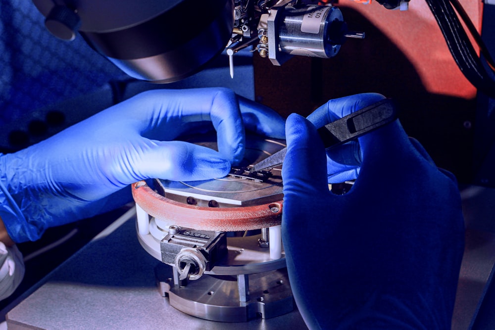 man holding silver component