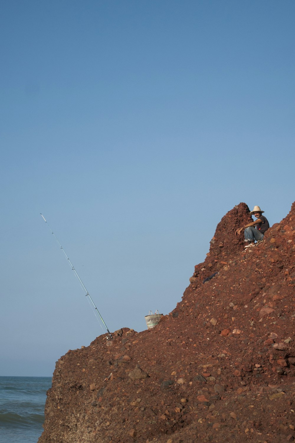 man sitting on mountain