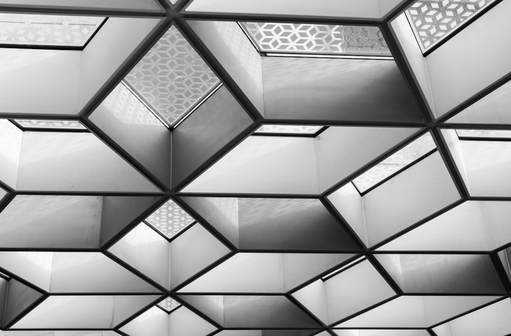 a black and white photo of a ceiling made of mirrors