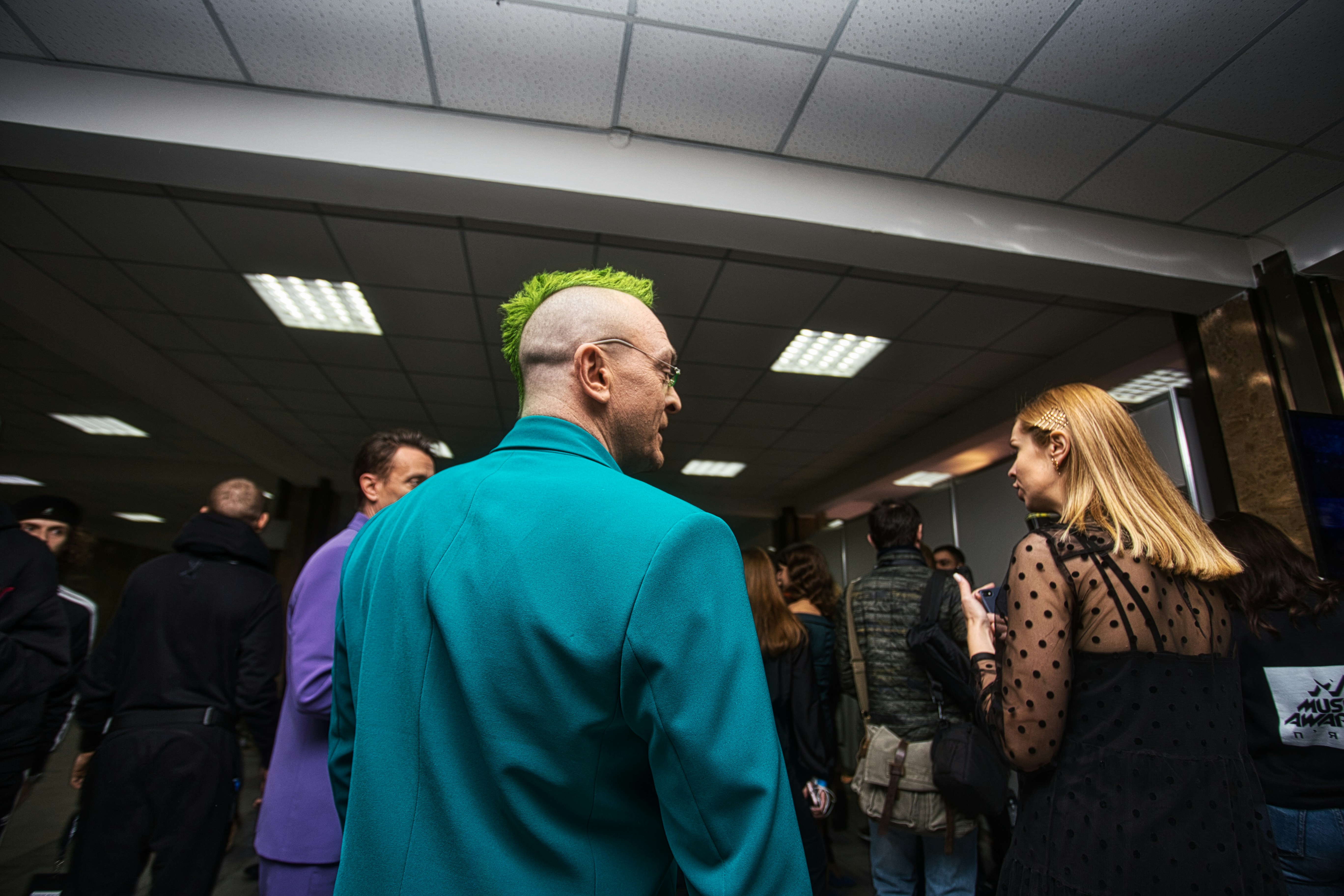 Man in green suit jacket
