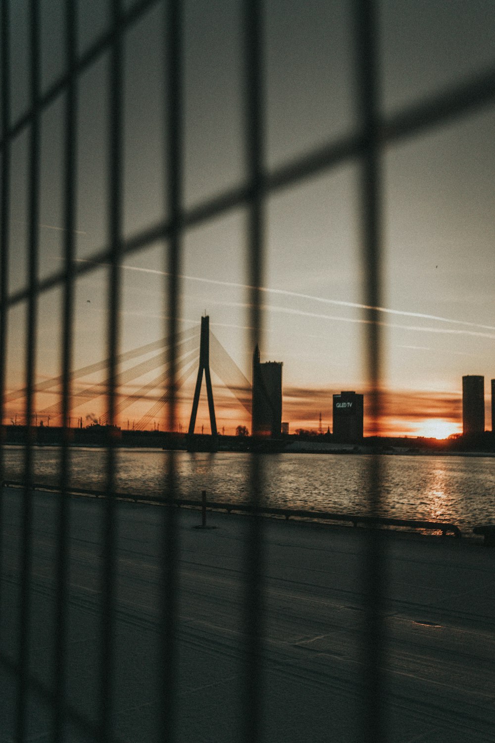 selective focus photo of bridge over calm body of water