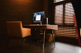 Bright executive room with a sleek desk and ergonomic chair.