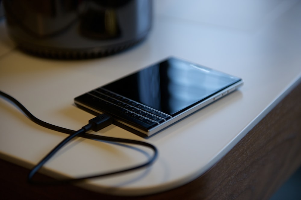 black Blackberry Passport on white tbale