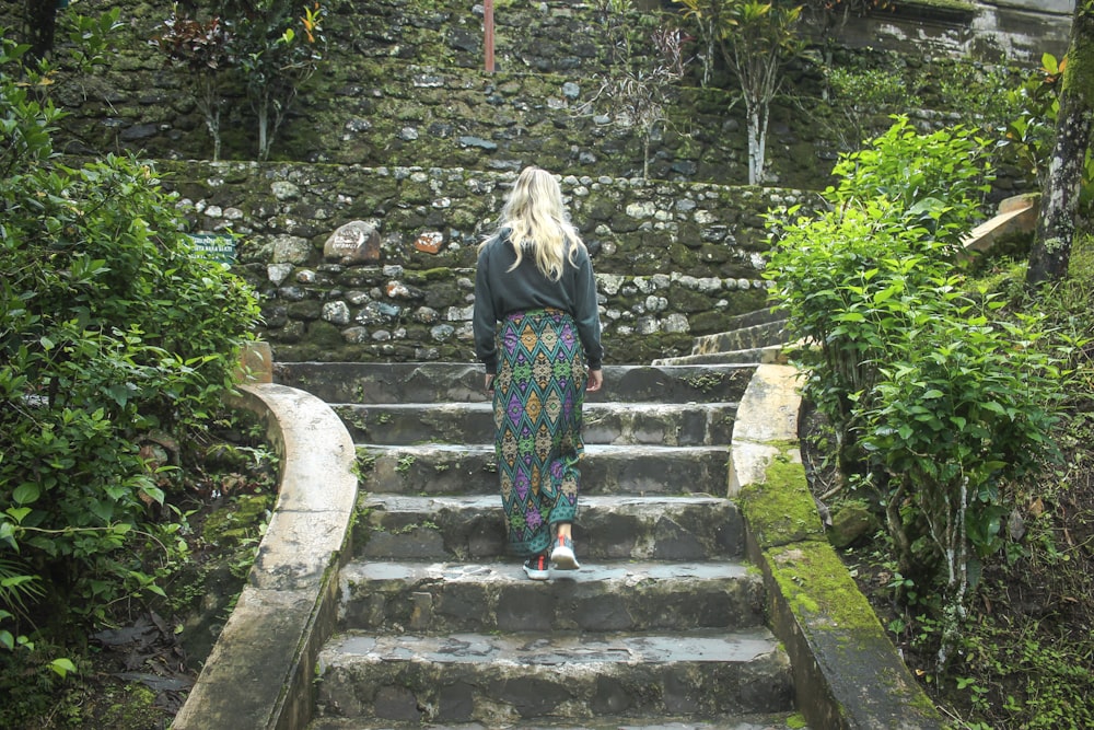 woman walking on stairs during daytime